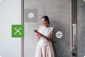Woman using smartphone with floating icons for biometrics, facial recognition, and global connectivity.