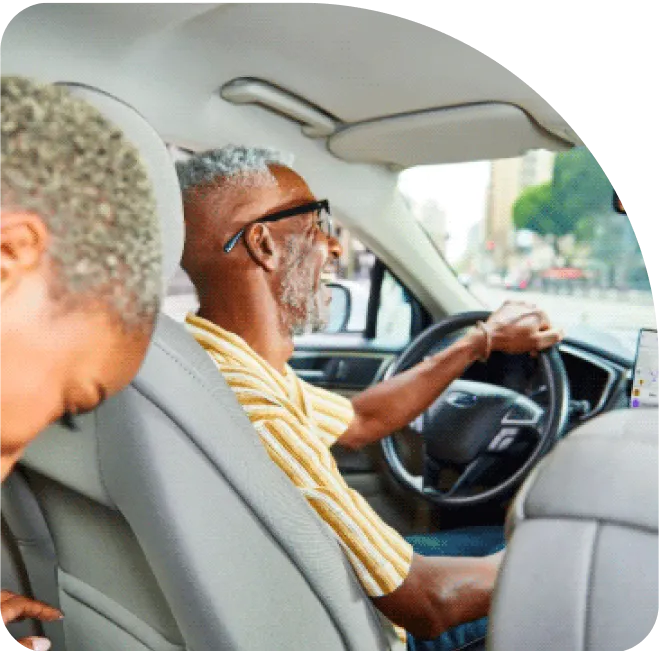 Ride share driver with passenger in car.