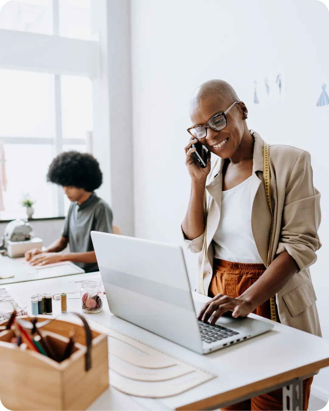 Professional standing at desk at home to represent VPN-less options of working at home securely with Duo.